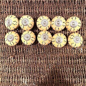 Many sets of 10 yellow ceramic knob/pull